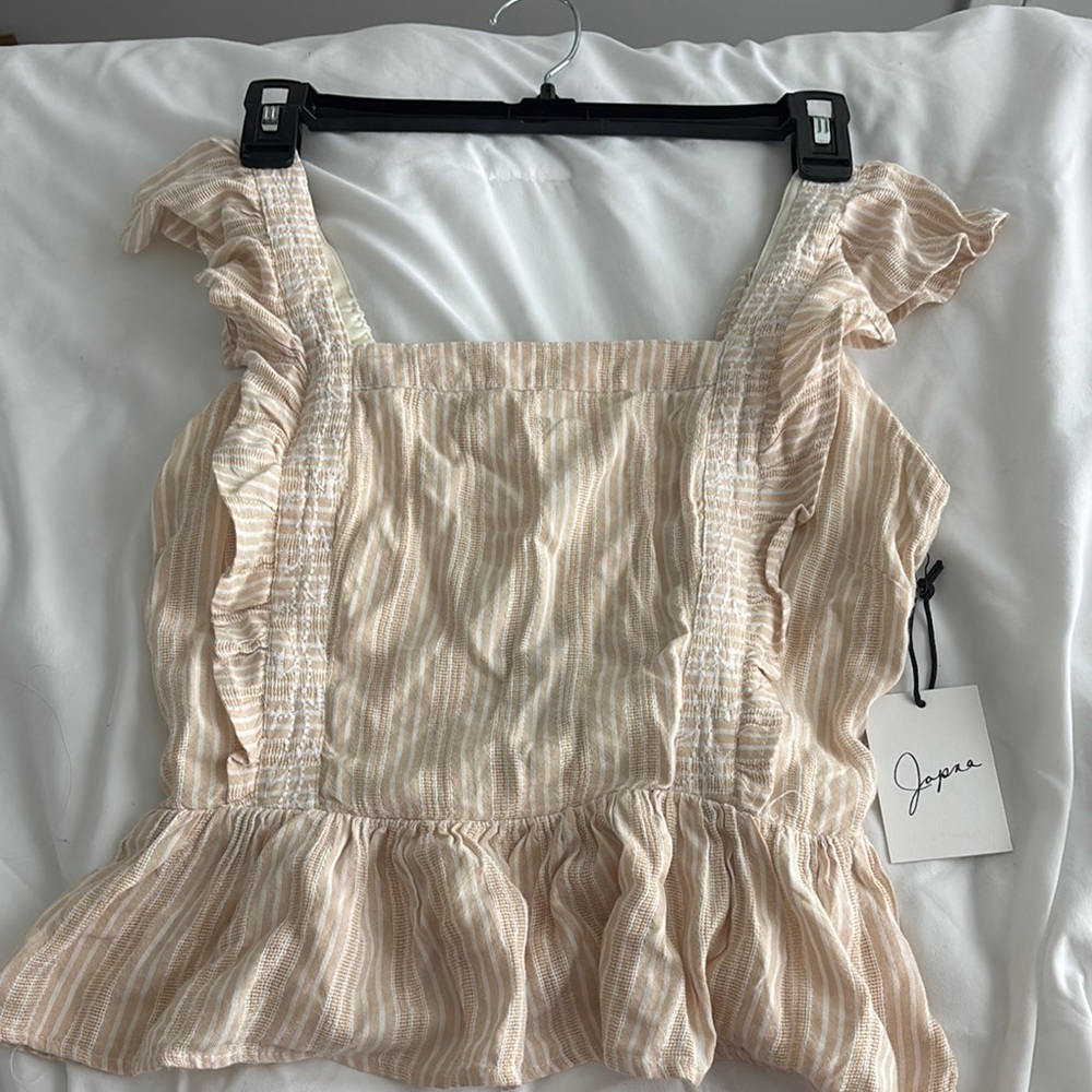 Japna Cream Sleeveless Ruffled Peplum Blouse